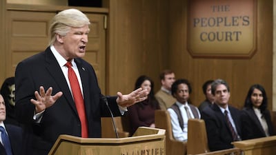 This Saturday, Feb. 11, 2017, image released by NBC shows host Alec Baldwin as President Donald Trump during the “Trump People’s Court” in New York. In his spoof, President Trump made good on a tweeted vow to “see you in court” directed at the three Ninth Circuit federal judges who refused to lift a stay preventing his immigration ban from being enforced. His chosen venue: “The People’s Court,” where he was suing the three judges. Will Heath / NBC via AP