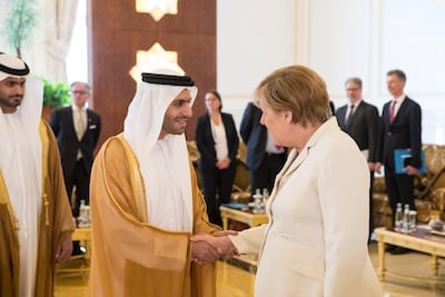 Shurooq chief Marwan Al Serkal, pictured with German Chancellor Angela Merkel in 2017, says the UAE should have a single road toll system. Ryan Carter / Crown Prince Court - Abu Dhabi