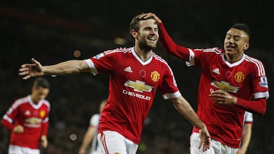 Manchester United's Juan Mata celebrates scoring their second goal with Jesse Lingard. Reuters