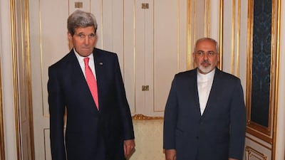 The US secretary of state John Kerry and Iranian foreign minister Mohammad Javad Zarif, right, pose for a photograph before a meeting in Vienna on November 23, 2014. Ronald Zak / AP Photo
