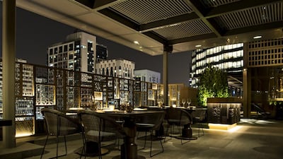 Tamba, Abu Dhabi’s latest Indian-inspired fusion restaurant, has an open kitchen and plenty of wooden trellises. Courtesy Tamba