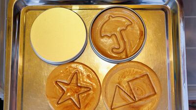 Dalgona is typically sold with a variety of shapes but Squid Game featured four, a triangle, circle, star and an umbrella. Reuters