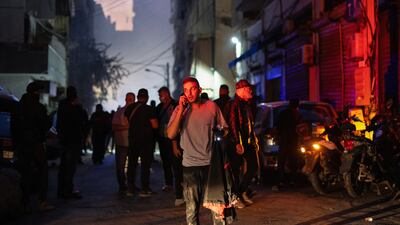 A civil defence member stands at the site of an Israeli strike in Beirut's Basta neighbourhood. Reuters