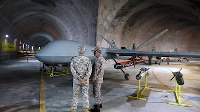 Senior military figures inspect Iranian drones, which have been used by Russia in Ukraine. The UK's Air Marshal Martin Sampson is concerned about what Tehran has received in return. AFP