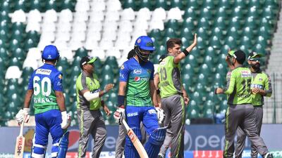 Lahore Qalandars; Shaheen Shah Afridi, third right, celebrates the wicket of Multan Sultans' Moeen Ali. AFP