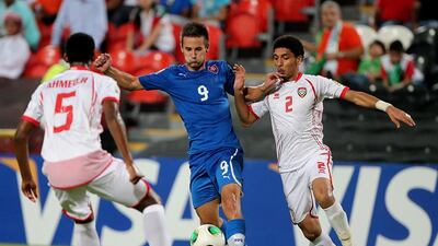 Tomas Vestenicky, in blue, scored both goals for Slovakia last night. Satish Kumar / The National