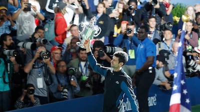 epa07009432 Novak Djokovic of Serbia celebrates with the championship trophy after defeating Juan Martin del Potro of Argentina in the men's final on the fourteenth day of the US Open Tennis Championships the USTA National Tennis Center in Flushing Meadows, New York, USA, 09 September 2018. The US Open runs from 27 August through 09 September. EPA/JASON SZENES *** Local Caption *** 53000073