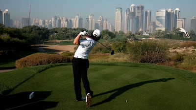 Ireland's Rory McIlroy plays a tee shot on the 8th hole during the third day of the Dubai Desert Classic golf tournament in the Gulf emirate on January 31, 2009. The Irish teenage prodigy grabbed the halfway lead with a 25-foot eagle putt on the last. AFP PHOTO/KARIM SAHIB *** Local Caption *** 212486-01-08.jpg
