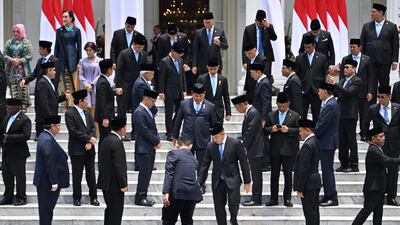 Ministers of Indonesian President Prabowo Subianto's cabinet gather for a photo after their swearing-in ceremony at the Presidential Palace in Jakarta. AFP