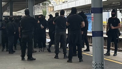 Masked anti-migrant protesters at Dover train station, on the day about 300 Patriot Platform supporters gathered for a rally in the coastal town early this month. Getty Images