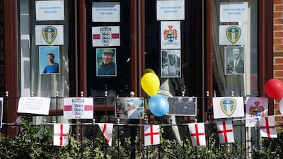 People pay their respects as the funeral cortege of Jack Charlton passes through Northumberland in Ashington on Tuesday. The former Republic of Ireland manager, who won the World Cup, playing for England in 1966 died on July 10 aged 85. EPA