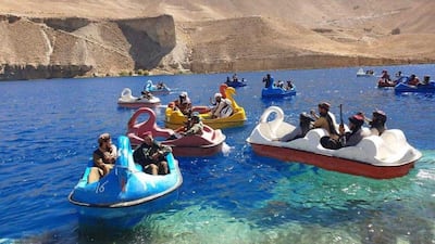 Taliban fighters ride boats on Band-e Amir lake, once a popular destination for local tourists, in Afghanistan's Bamyan province.
