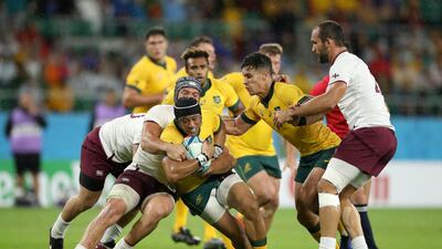 Christian Lealiifano of Australia is tackled against Georgia. Getty