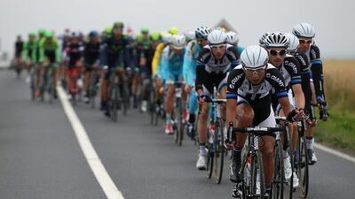Ji Cheng of China and Team Giant-Shimano drives the peloton during stage six of the 2014 Le Tour de France from Arras to Reims on July 10, 2014 in Arras, France. Doug Pensinger/Getty Images