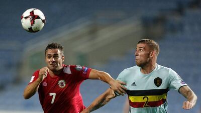 Gibraltar forward Lee Casciaro, left, vies with Belgium defender Toby Alderweireld. Jose Manuel Ribeiro / AFP