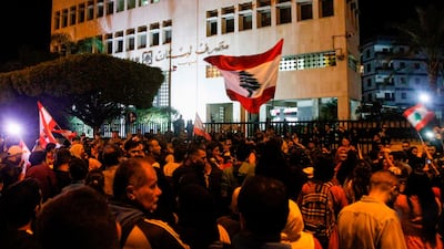 A recent protest outside the Sidon branch of the Banque du Liban, Lebanon's Central Bank. The central bank's governor, Riad Salameh, has told the Association of Banks in Lebanon he intends to issue a circular cutting interest rates in a bid to revive the country's flagging economy and reduce the risk of debt defaults. AFP