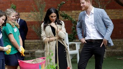 Harry and Meghan visit a school.