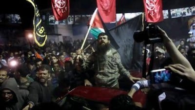 Palestinian Khader Adnan, centre, a senior member of Islamic Jihad, is greeted by Palestinians after his release from prison.