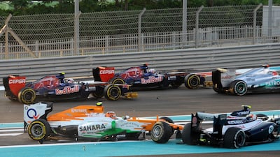 Williams' Brazilian driver Bruno Sena (bottom R) and Force India's German driver Nico Hulkenberg (bottom L) crash at the Yas Marina circuit, in Abu Dhabi, during the Abu Dhabi Formula One Grand Prix on November 4, 2012 . AFP PHOTO/TOM GANDOLFINI *** Local Caption *** 818564-01-08.jpg