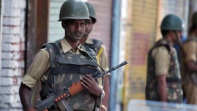 Indian Central Reserve Police Force (CRPF) troopers stand alert as they enforce curfew restrictions in Srinagar on Aug 24 2008, a day ahead of a planned rally by Muslim separatists.