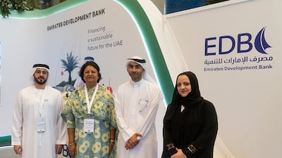 Ahmed Al Naqbi of Emirates Development Bank, left, and Gauri Singh of Irena, second left, at the alliance announcement. Photo: EDB