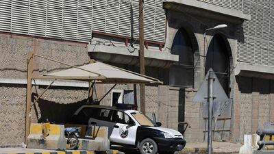 A police vehicle is positioned outside the UAE embassy after it was closed in Sanaa on February 14, 2015. Khaled Abdullah/Reuters