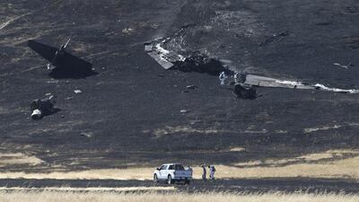 A US Air Force Hazmat team inspects the wreckage of the U-2 spy plane that crashed in the Sutter Butte mountains. Rich Pedroncelli / AP Photo