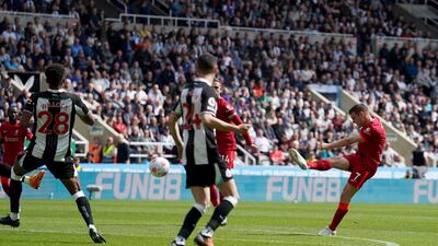 Liverpool's James Milner shoots in the Premier League game against Newcastle United at St James' Park. AP