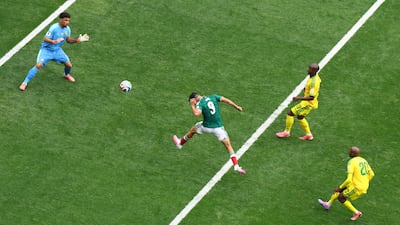 Mexico's Raul Jimenez scores their second goal against South Africa at the Estadio Azteca in Mexico City. Reuters