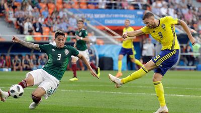 Marcus Berg, right, has been central to Sweden's march to the World Cup knockout stages. Gregorio Borgia / AP Photo