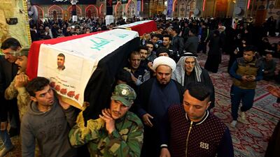 Mourners carry the flag-draped coffins of two fighters of the Popular Mobilisation Forces, who were killed on Sunday in an attack southwest of the northern city of Kirkuk. Officials said Islamic State militants ambushed the group of paramilitaries, killing at least 27 fighters / AP