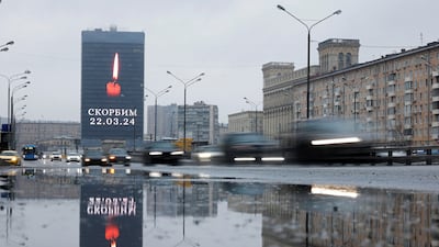 An electronic screen displays the message 'We mourn' in memory of the victims of the shooting attack, in Moscow. Reuters
