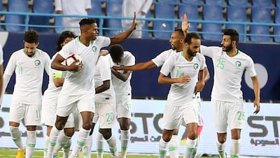 Saudi Arabia players celebrate Abdulaziz Al Bishi's 94th-minute opener. EPA