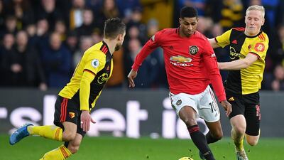 Manchester United striker Marcus Rashford (C) vies with Watford's Spanish defender Kiko Femenia. AFP