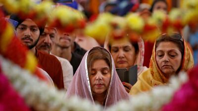 Devotees offer prayers inside a Sikh temple to mark the 550th birth anniversary of Guru Nanak Dev, the first Sikh Guru and founder of Sikh faith, in Chennai, India, November 12, 2019. Reuters