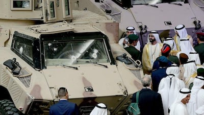 Sheikh Mohammed bin Rashid, Vice President and Prime Minister of the UAE and Ruler of Dubai, views armoured vehicles on the first day of the International Defence Exhibition and Conference in Abu Dhabi. EPA
