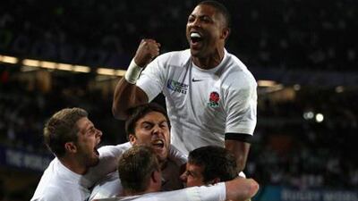 England players celebrate Chris Ashton's match-winning try.