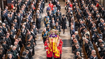 King Charles III follows the coffin of Queen Elizabeth as it leaves Westminster Abbey after her state funeral in September 2022