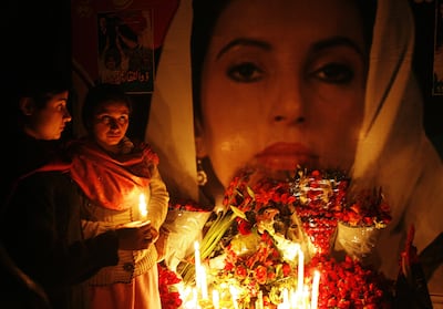 Supporters of assassinated former premier Benazir Bhutto's Pakistan People's Party (PPP) hold candles during a homage ceremony in Lahore on December 29, 2007. Arif Ali / AFP