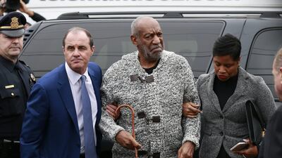 Actor and comedian Bill Cosby is helped as he arrives for a court appearance, Wednesday, Dec 30, 2015, in Elkins Park, Pennyslvania. Cosby was arrested and charged with drugging and sexually assaulting a woman at his home in January 2004. David Swanson / The Philadelphia Inquirer via AP