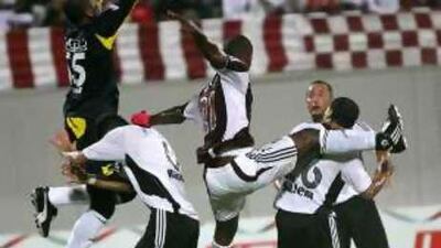 Al Jazira keeper Ali Kosif dominates his area.