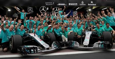 Mercedes-GP drivers, mechanics and engineers celebrate their fifth successive F1 constructors' championship in Brazil. Reuters
