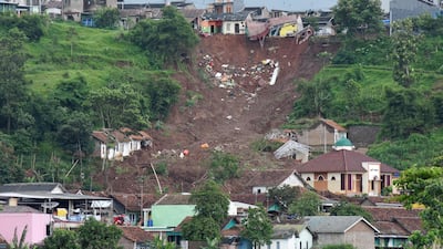 The aftermath of a landslide which swept away homes the day before, in Sumedang, West Java province, Indonesia. AFP