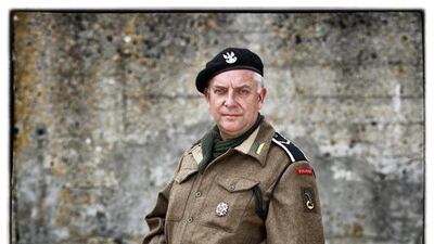 George Lesniak, from the United Kingdom, wears a replica uniform of a 10th Mounted Rifleman of the 1st Polish Armoured Division.