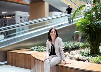 Ms Ozbek says she is not a good bank client because she stops her lender from increasing the credit limit on her credit card. Reem Mohammed/The National