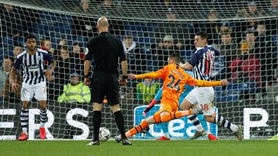 Newcastle United's Miguel Almiron scores to make it 2-0 against WBA in their FA Cup fifth round match at The Hawthorns. Reuters