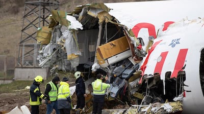 Firefighters and Pegasus Airlines crew inspect the wrecked plane after a Pegasus Airlines plane skidded off the Sabiha Goekcen airport runway in Istanbul, Turkey. EPA