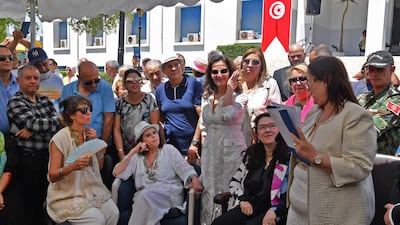Claudia Cardinale, centre, listens to a speech by Amel Limam, right, Mayor of La Goulette, as she honours the actress.