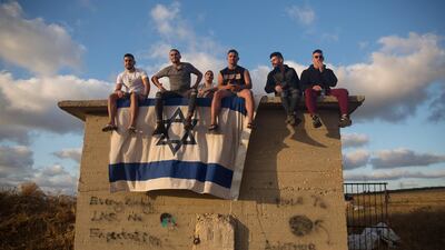 Israelis gather to watch the Iron Dome missile defence system launch to intercept rockets fire from the Gaza Strip on May 17, in Ashdod, Israel. Getty
