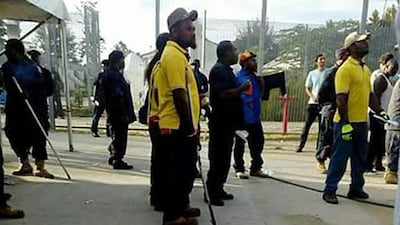 Police enter the refugee detention camp on Manus Island on November 23, 2017 to begin removing about 400 men who refused to move to new accommodation. Refugee Action Coalition via AP